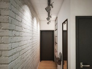 Белая кирпичная стена в коридоре
